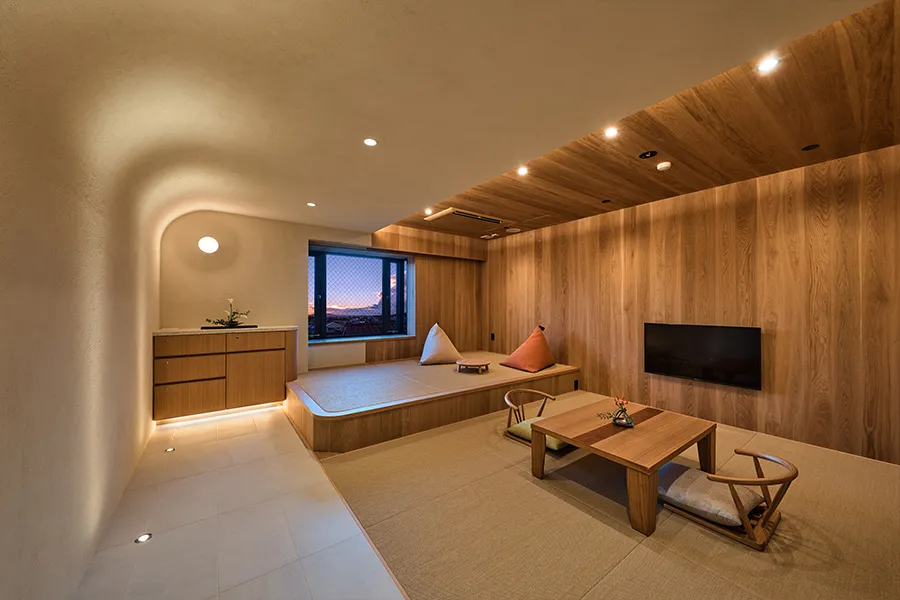 A modern Japanese-style room with a view of Mt. Ikoma Manyo